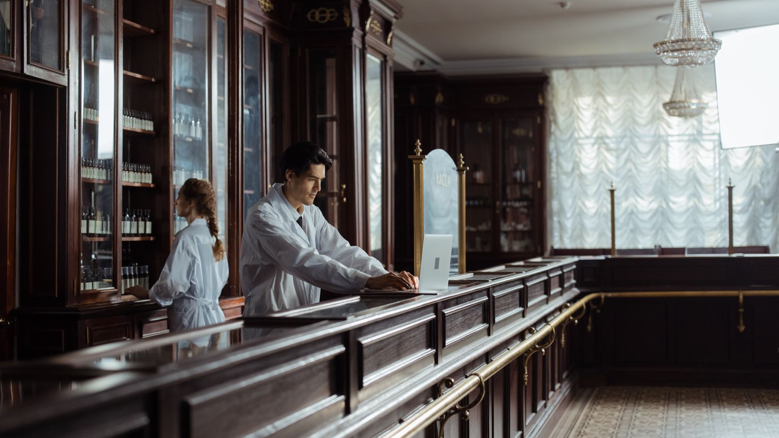 Pharmacy staff working behind the counter