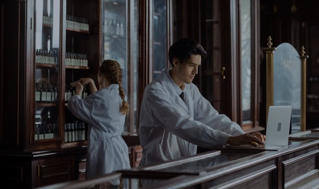 Pharmacy colleagues working behind a pharmacy counter