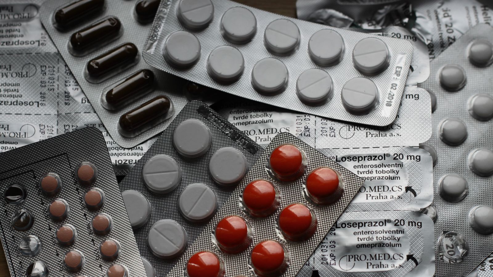 Blister packs of tablets and capsules stacked together