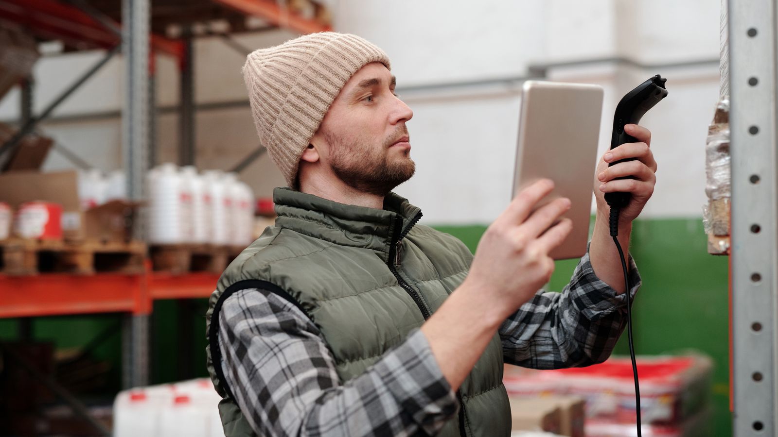 A hand scanning a product barcode on a shelf
