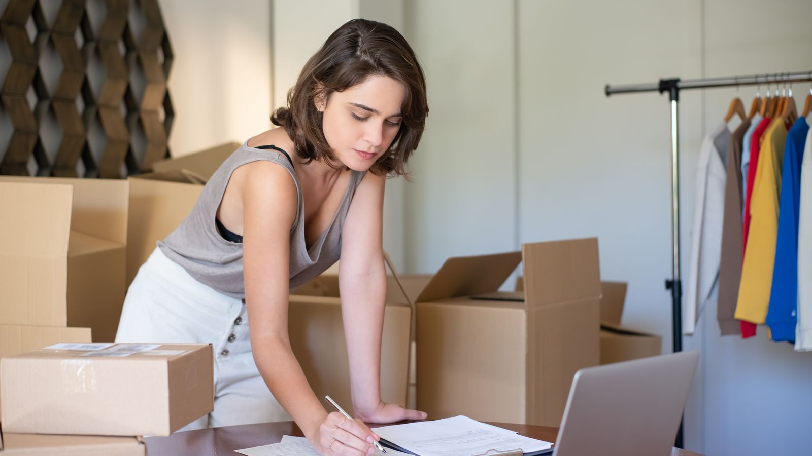 A small business owner packing orders